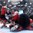 ST. PETERSBURG, RUSSIA - MAY 11: Finland's Teemu Pulkkinen #56 clashes with Hungary's Istvan Mestyan #61 and Zsombor Garat #70 beside Adam Vay #30 during preliminary round action at the 2016 IIHF Ice Hockey World Championship. (Photo by Minas Panagiotakis/HHOF-IIHF Images)

